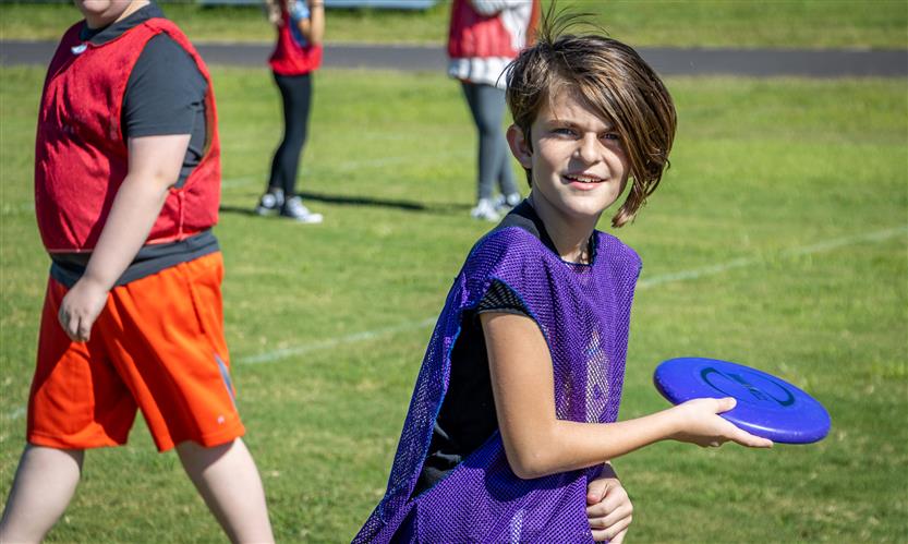 Students play ultimate frisbee